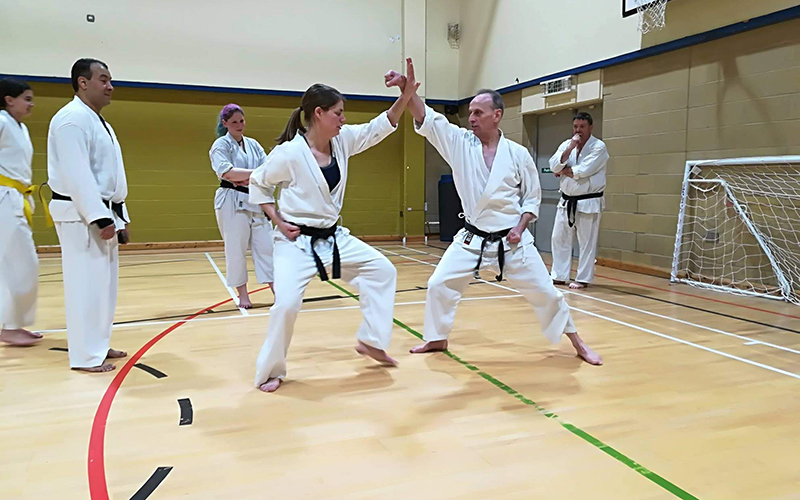 Female member blocking a punch