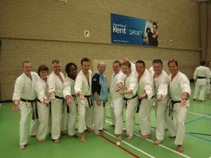 Club photo, everyone wearing karate kits, with Master Harada in the centre